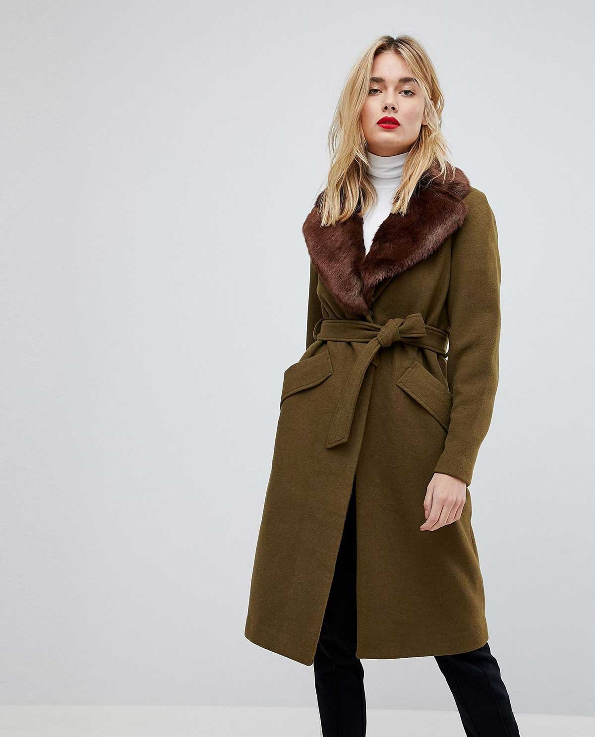 Model wearing the Juniper wool wrap coat in olive with a shearling collar