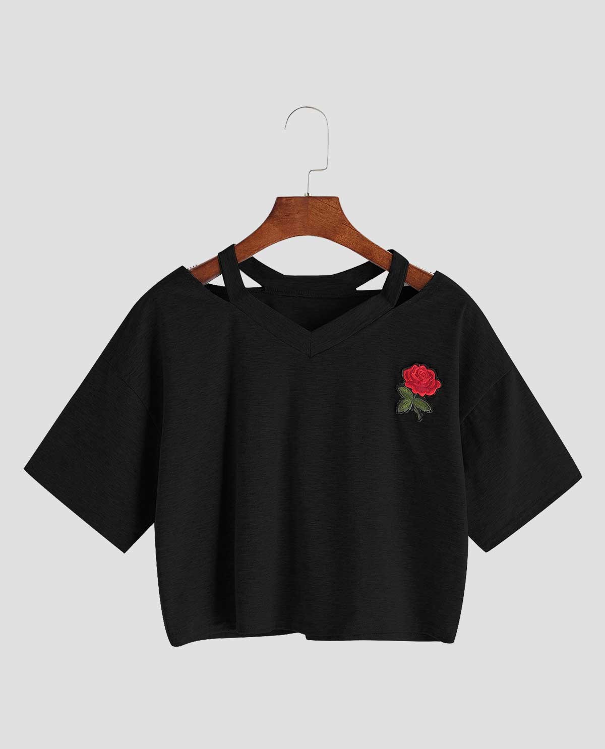 Rosa embroidered tee in black on a wooden hanger